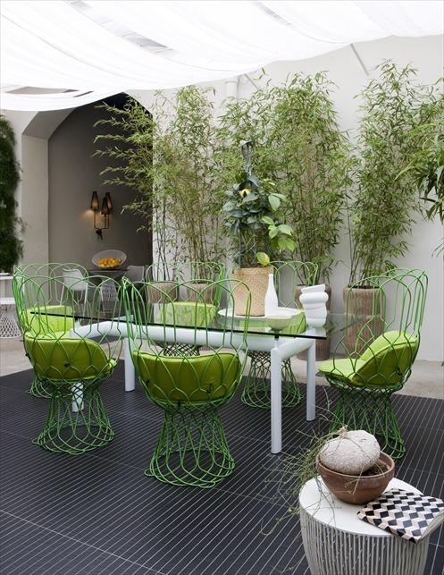 apple green summers hottest hue patio garden chairs cushions walls plants decor decorating summer