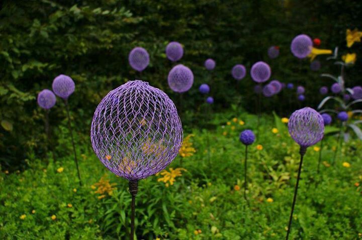 garden sculptures flowerbed spheres wire grapevines bucket decor vegetables flowers backyard