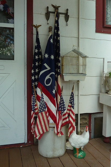 Celebrate Independance Day with these Patriotic Porch Decor Ideas flags diy budget shutter tissue paper firecrackers flowers pillows plants accessories party bbq get together patriotic july 4th6