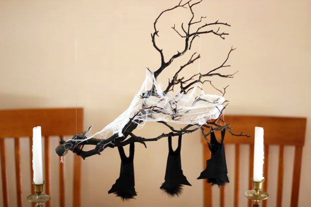 Make This Hanging Bat Centerpiece For Your Halloween Party! glue felt fake fur spray paint branch easy budget11