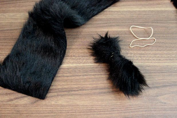 Make This Hanging Bat Centerpiece For Your Halloween Party! glue felt fake fur spray paint branch easy budget4