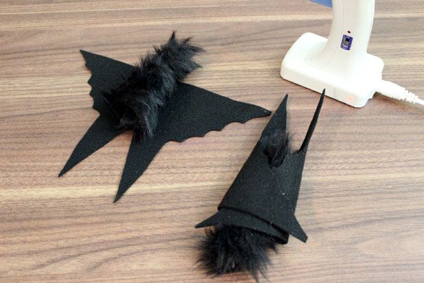 Make This Hanging Bat Centerpiece For Your Halloween Party! glue felt fake fur spray paint branch easy budget5