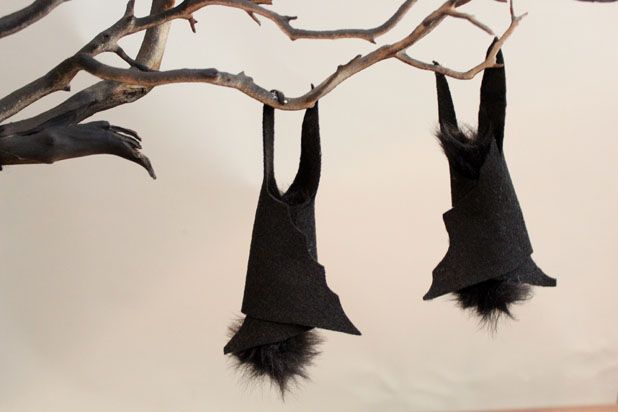 Make This Hanging Bat Centerpiece For Your Halloween Party! glue felt fake fur spray paint branch easy budget7