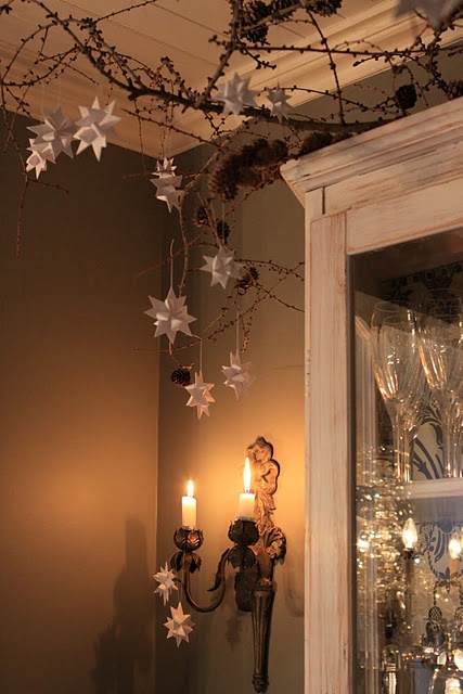 10 Rustic Christmas Decor Ideas You Can Recreate on the Cheap branches reindeer snowflakes stars moss wood thrift store easy budget friendly1