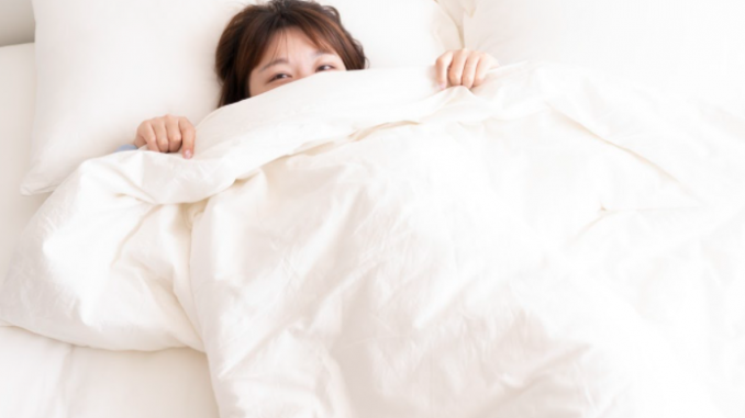 sleeping with a weighted blanket how to increase sleep quality 2