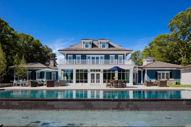 Big house with pool in backyard.